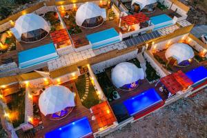 an aerial view of a resort with a pool and a building at Kalkan Dome Suites & Deluxe-Glamping Holiday in Kalkan in Kas