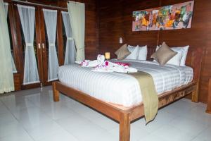 Kurnia Guest House & Spa客房内的一张或多张床位
