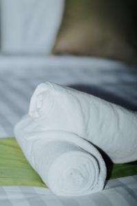 Kurnia Guest House & Spa客房内的一张或多张床位