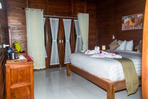 Kurnia Guest House & Spa客房内的一张或多张床位