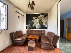 a living room with a couch and a table at Holiday Home in Gonio in Gonio