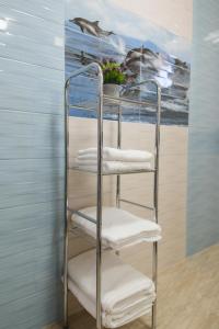 a metal towel rack with towels on it at Vila Helena in Sibiu