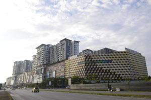 a group of tall buildings on the side of a street at #2.1 Jazz Suites Large Bed Vivacity Kuching 3rooms in Kuching