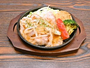 a bowl of food with meat and vegetables on a table at APA Hotel Asakusa Shin Okachimachi Ekimae in Tokyo