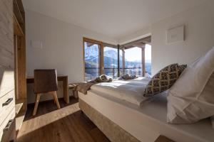 Posteľ alebo postele v izbe v ubytovaní Luech da Perteut - Panorama and Wellness
