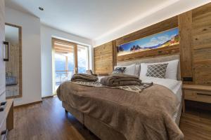 Posteľ alebo postele v izbe v ubytovaní Luech da Perteut - Panorama and Wellness