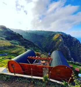 a boat on the side of a mountain at The tiny black bird in Fajã da Ovelha