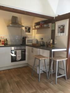 A cozinha ou cozinha compacta de The Stable Loft...a cosy self contained apartment