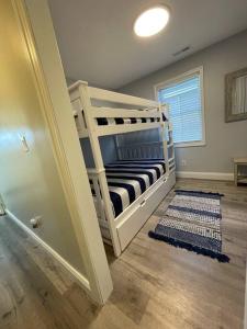 a bedroom with a bunk bed in a room at Beautifully Renovated Home with Water Views in Villas