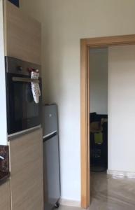 Kuchyň nebo kuchyňský kout v ubytování Bel appartement pied sur mer vue imprenable sur piscine et jardins