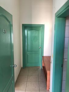a hallway with a green door in a room at Melissa Garden Apart Hotel in Side