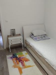Voodi või voodid majutusasutuse Apartman All seasons toas