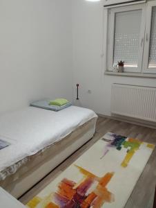 Voodi või voodid majutusasutuse Apartman All seasons toas
