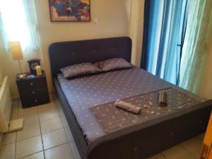 a small bed in a small room with at AlkyonaBeach Polimeris in Platanitis