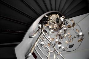 a chandelier hanging from a ceiling at Hotel Zaragoza Plaza in Donostia-San Sebastián