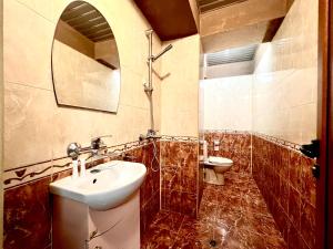 a bathroom with a sink and a toilet at Hotel Maria in Vratsa +80 photos