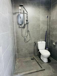 a bathroom with a shower and a toilet at EmpiStudio @ Empire Damansara in Petaling Jaya