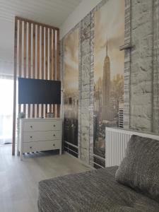 a bedroom with a wall mural of a city at Ferienwohnung Lavanda in Rust