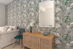 a living room with a mirror and a couch at Apartment Patricia in Zakynthos