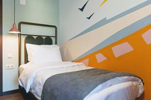 Letto o letti in una camera di Paliani Hotel