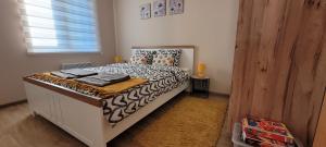 Postel nebo postele na pokoji v ubytování ALF apartmani + 132 fotografií