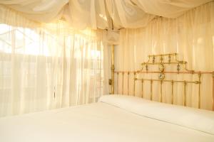 Postel nebo postele na pokoji v ubytování Hotel Ateneo Sevilla