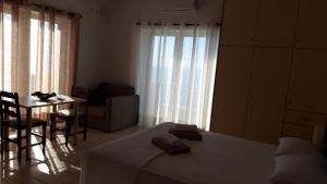 Ένα ή περισσότερα κρεβάτια σε δωμάτιο στο Villa Tzortzaki - Afroditi +19 φωτογραφίες