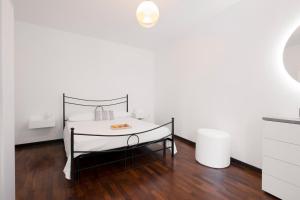 Ένα ή περισσότερα κρεβάτια σε δωμάτιο στο Padova House