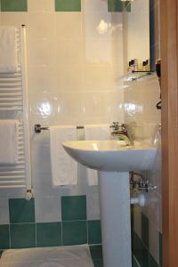 Koupelna v ubytování Hotel Caneo
