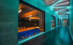 a swimming pool in the middle of a building at Lux modern apartment in Krakow