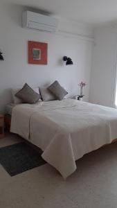 Posteľ alebo postele v izbe v ubytovaní Bel appartement avec grande terrasse ensoleillée et jardin