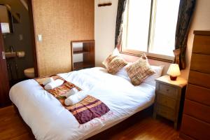 Postel nebo postele na pokoji v ubytování Panketo Lodge & Yoga Studio