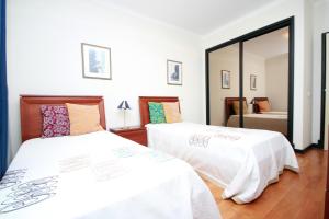 Krevet ili kreveti u jedinici u okviru objekta Forum Apartment by HR Madeira