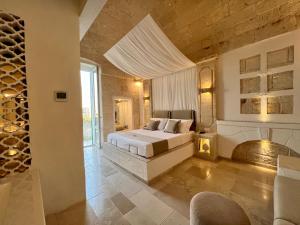 Postel nebo postele na pokoji v ubytování Vittorio Emanuele Charming Suites