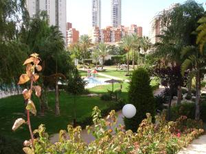 a park with a pool and buildings in the background at Gemelos 22 - Zand Properties in Benidorm