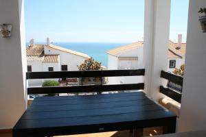 a balcony with a view of the ocean at Bungalow Mediterraneo in Santa Pola