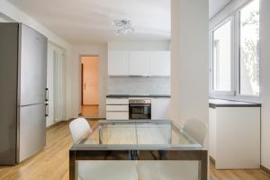 A kitchen or kitchenette at Bologna Suite Centre City