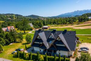 an aerial view of a house with a roof at Suchowianka Ski&Relax in Białka Tatrzańska +62 photos