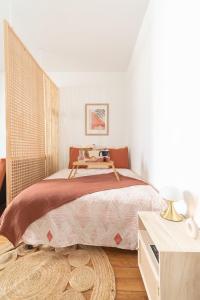 A bed or beds in a room at Cosy et comfort studio équipé à Clichy 5 min Métro
