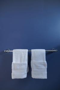 two towels hanging on a towel rack in a bathroom at Montgomery condo in Philadelphia