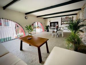 a living room with a couch and a table at Il Palazzetto - La terrazza di Elia in Cividale del Friuli