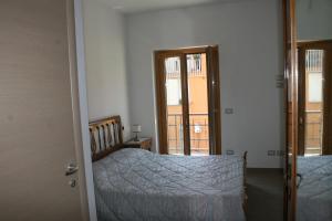 Posteľ alebo postele v izbe v ubytovaní B&B della Contrada Varenna