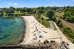 an aerial view of a beach with people on it at The Niantic Inn in Niantic