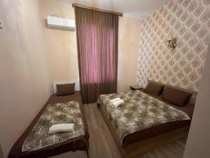 Voodi või voodid majutusasutuse Hotel Alley toas