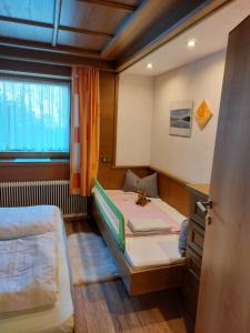 Postel nebo postele na pokoji v ubytování Zillertal Apartment mit Traumausblick - Haus Kirchler