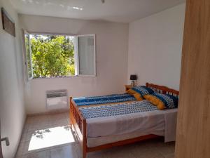 Posteľ alebo postele v izbe v ubytovaní Appartement avec extérieur et parking gratuit