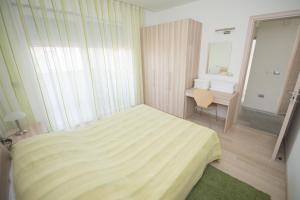 Postel nebo postele na pokoji v ubytování Villa Danex Premium