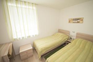 Postel nebo postele na pokoji v ubytování Villa Danex Premium