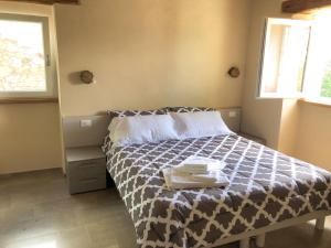 A bed or beds in a room at Agriturismo Cascina Cornelli