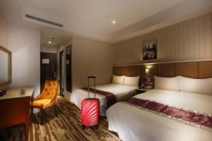 Llit o llits en una habitació de Grace Hotel